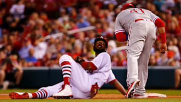 ST. LOUIS, MO - MAY 17: Dexter Fowler #25 of the St. Louis Cardinals looks at Carlos Santana #41 of the the Philadelphia Phillies after diving back to first base on a pick off attempt in the seventh inning at Busch Stadium on May 17, 2018 in St. Louis, Missouri. (Photo by Dilip Vishwanat/Getty Images)