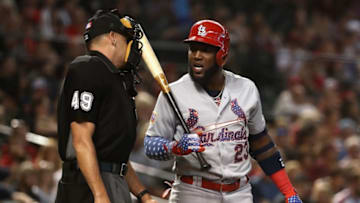 PHOENIX, AZ - JULY 02: Marcell Ozuna #23 of the St. Louis Cardinals reacts to home plate umpire Andy Fletcher after a called third strike during the first inning of the MLB game against the Arizona Diamondbacks at Chase Field on July 2, 2018 in Phoenix, Arizona. (Photo by Christian Petersen/Getty Images)