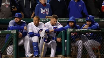 CHICAGO, IL - OCTOBER 19: Members of the Chicago Cubs look on from the dugout in the ninth inning against the Los Angeles Dodgers during game five of the National League Championship Series at Wrigley Field on October 19, 2017 in Chicago, Illinois. (Photo by Jamie Squire/Getty Images)