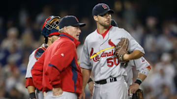 LOS ANGELES, CA - AUGUST 19: St. Louis Cardinals pitching coach Dave Duncan talks with pitcher Adam Wainwright