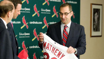 ST. LOUIS, MO - NOVEMBER 14: St. Louis Cardinals general manager John Mozeliak (R) introduces Mike Matheny as the new manager during a press conference at Busch Stadium on November 14, 2011 in St. Louis, Missouri. (Photo by Jeff Curry/Getty Images)