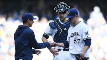 MILWAUKEE, WI - MAY 06: Chase Anderson #57 of the Milwaukee Brewers is relieved by Craig Counsell #30 during the sixth inning of a game against the Pittsburgh Pirates at Miller Park on May 6, 2018 in Milwaukee, Wisconsin. (Photo by Stacy Revere/Getty Images)