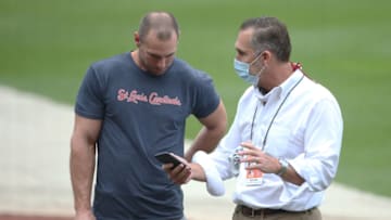 John Mozeliak (right) before a game against the Pittsburgh Pirates at PNC Park. Mandatory Credit: Charles LeClaire-USA TODAY Sports