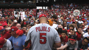 Albert Pujols (5) signs autographs prior to his first game back at Busch Stadium against the St. Louis Cardinals. Mandatory Credit: Jeff Curry-USA TODAY Sports