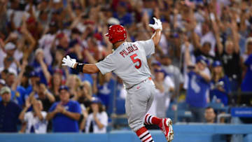 Albert Pujols (5) celebrates after hitting a three run home run and the 700th of his career against the Los Angeles Dodgers during the fourth inning at Dodger Stadium. Mandatory Credit: Gary A. Vasquez-USA TODAY Sports