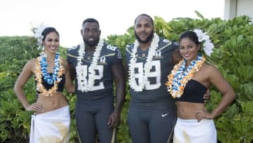 January 29, 2016; Kahuku, HI, USA; Hawaiian hostesses Chelsea Hardin (far left) and Mahina Garcia (far right) pose with Team Irvin tight end Delanie Walker of the Tennessee Titans (82) and Team Irvin lineman Jurrell Casey of the Tennessee Titans (99) during 2016 Pro Bowl photo day at Turtle Bay Resort. Mandatory Credit: Kyle Terada-USA TODAY Sports