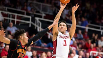 Feb 25, 2016; Stanford, CA, USA; Stanford Cardinal guard Dorian Pickens (11) shoots a three point shot over USC Trojans forward Bennie Boatwright (25) in the first half at Maples Pavilion. Mandatory Credit: John Hefti-USA TODAY Sports