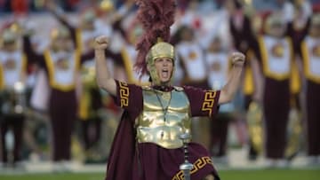 Dec 27, 2014; San Diego, CA, USA; Southern California Trojans drum major mascot Tommy Trojans thrusts his sword into the field before the 2014 Holiday Bowl against the Nebraska Cornhuskers at Qualcomm Stadium. Mandatory Credit: Kirby Lee-USA TODAY Sports