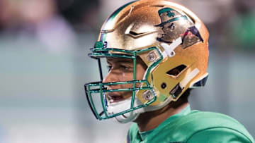 Nov 21, 2015; Boston, MA, USA; Notre Dame Fighting Irish quarterback DeShone Kizer (14) wears the special edition Shamrock Series helmet during warmups for the game against the Boston College Eagles at Fenway Park. Mandatory Credit: Matt Cashore-USA TODAY Sports