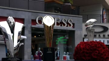 Jul 15, 2016; Hollywood, CA, USA; General view of the Pac-12 Championship game trophy (left), College Football Playoff national championship trophy (center) and Leishman Trophy (Rose Bowl) during Pac-12 media day at Hollywood & Highland. Mandatory Credit: Kirby Lee-USA TODAY Sports
