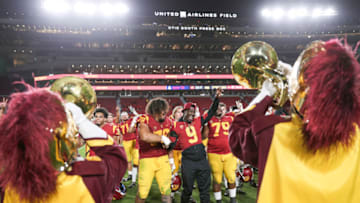 USC football players celebrate. (Meg Oliphant/Getty Images)