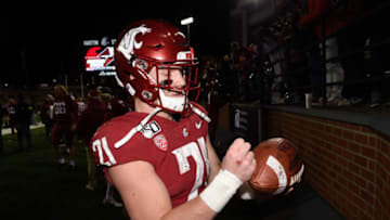 Nov 16, 2019; Pullman, WA, USA; Washington State Cougars running back Max Borghi (21) signs a football after a game against the Stanford Cardinal at Martin Stadium. The Cougars won 49-22. Mandatory Credit: James Snook-USA TODAY Sports