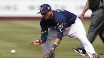 Mar 11, 2016; Phoenix, AZ, USA; Milwaukee Brewers second baseman Colin Walsh (73) fields the ball against the Texas Rangers in the second inning during a spring training game at Maryvale Baseball Park. Mandatory Credit: Rick Scuteri-USA TODAY Sports