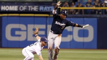 Jul 28, 2014; St. Petersburg, FL, USA; Milwaukee Brewers center fielder Carlos Gomez (27) reacts after he is safe from stealing second base as Tampa Bay Rays second baseman Logan Forsythe (10) attempted to tag him out during the third inning at Tropicana Field. Mandatory Credit: Kim Klement-USA TODAY Sports
