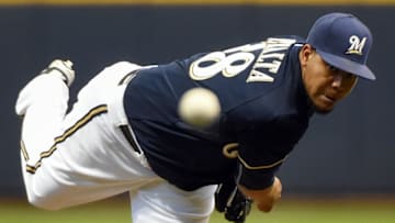 Apr 20, 2015; Milwaukee, WI, USA; Milwaukee Brewers pitcher Wily Peralta (38) pitches in the first inning against the Cincinnati Reds at Miller Park. Mandatory Credit: Benny Sieu-USA TODAY Sports