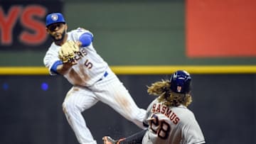 Apr 8, 2016; Milwaukee, WI, USA; Houston Astros left fielder Colby Rasmus (28) is forced out by Milwaukee Brewers shortstop Jonathan Villar (5) and was called for interference resulting in a double play in the ninth inning and ending the game at Miller Park. The Brewers beat the Astros 6-4. Mandatory Credit: Benny Sieu-USA TODAY Sports