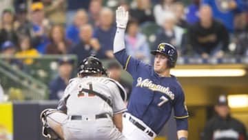 May 1, 2016; Milwaukee, WI, USA; Milwaukee Brewers third baseman Colin Walsh (7) is tagged out on a play at home plate by Miami Marlins catcher J.T. Realmuto (11) during the fourth inning at Miller Park. Mandatory Credit: Jeff Hanisch-USA TODAY Sports