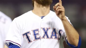 Sep 25, 2014; Arlington, TX, USA; Texas Rangers relief pitcher Michael Kirkman (50) leaves the game in the eighth inning against the Oakland Athletics at Globe Life Park in Arlington. Texas beat Oakland 2-1. Mandatory Credit: Tim Heitman-USA TODAY Sports