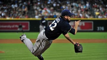 Jul 26, 2015; Phoenix, AZ, USA; Milwaukee Brewers starting pitcher Matt Garza (22) fields a bunt hit by Arizona Diamondbacks right fielder Ender Inciarte (5) during the first inning at Chase Field. Mandatory Credit: Matt Kartozian-USA TODAY Sports