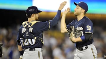 August 16, 2014; Los Angeles, CA, USA; Milwaukee Brewers right fielder Ryan Braun (8) celebrates with catcher Jonathan Lucroy (20)following the 3-2 victory against the Los Angeles Dodgers at Dodger Stadium. Mandatory Credit: Gary A. Vasquez-USA TODAY Sports