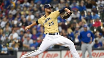 Oct 4, 2015; Milwaukee, WI, USA; Milwaukee Brewers pitcher Jorge Lopez (28) pitches in the first inning against the Chicago Cubs at Miller Park. Mandatory Credit: Benny Sieu-USA TODAY Sports