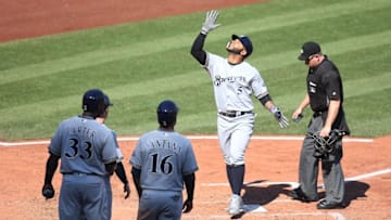 Sep 4, 2016; Pittsburgh, PA, USA; Milwaukee Brewers pinch hitter Jonathan Villar (5) gestures crossing home plate on a pinch hit grand slam home run against the Pittsburgh Pirates during the sixth inning at PNC Park. Mandatory Credit: Charles LeClaire-USA TODAY Sports