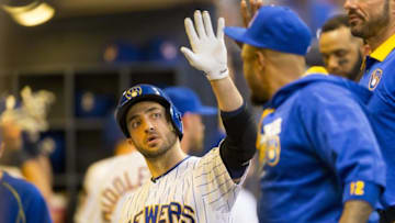 Jul 22, 2016; Milwaukee, WI, USA; Milwaukee Brewers left fielder Ryan Braun (8) high fives teammates after hitting a home run during the fourth inning against the Chicago Cubs at Miller Park. Mandatory Credit: Jeff Hanisch-USA TODAY Sports