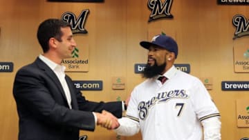 Nov 29, 2016; Milwaukee, WS, USA; Eric Thames is introduced as a Milwaukee Brewer by general manager David Stearns (left) during a press conference in Milwaukee. Mandatory Credit: Rick Wood/Milwaukee Journal Sentinel via USA TODAY NETWORK