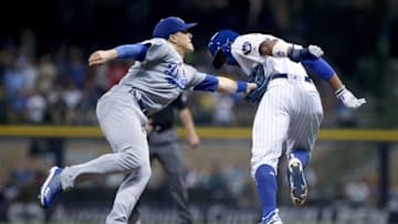 MILWAUKEE, WI - JULY 20: Enrique Hernandez #14 of the Los Angeles Dodgers tags out Keon Broxton #23 of the Milwaukee Brewers in the fifth inning at Miller Park on July 20, 2018 in Milwaukee, Wisconsin. (Photo by Dylan Buell/Getty Images)