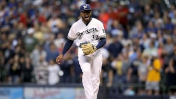 MILWAUKEE, WISCONSIN - JULY 22: Jeremy Jeffress #32 of the Milwaukee Brewers reacts after giving up a home run in the ninth inning against the Cincinnati Reds at Miller Park on July 22, 2019 in Milwaukee, Wisconsin. (Photo by Dylan Buell/Getty Images)