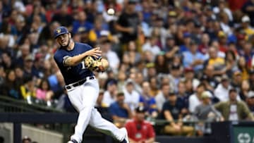 MILWAUKEE, WISCONSIN - AUGUST 13: Mike Moustakas #11 of the Milwaukee Brewers makes a throw to first base during the fifth inning against the Minnesota Twins at Miller Park on August 13, 2019 in Milwaukee, Wisconsin. (Photo by Stacy Revere/Getty Images)