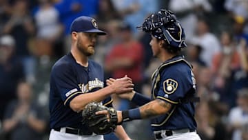 MILWAUKEE, WISCONSIN - SEPTEMBER 21: Jimmy Nelson #52 of the Milwaukee Brewers and JJacob Nottingham #26 of the Milwaukee Brewers celebrate the 10-1 victory against the Pittsburgh Pirates at Miller Park on September 21, 2019 in Milwaukee, Wisconsin. (Photo by Quinn Harris/Getty Images)