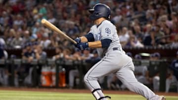 PHOENIX, ARIZONA - SEPTEMBER 28: Luis Urias #9 of the San Diego Padres hits an RBI single in the sixth inning of the MLB game against the Arizona Diamondbacks at Chase Field on September 28, 2019 in Phoenix, Arizona. (Photo by Jennifer Stewart/Getty Images)