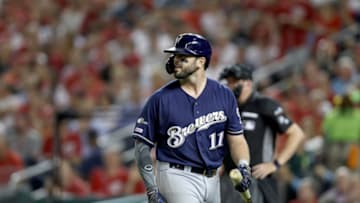WASHINGTON, DC - OCTOBER 01: Mike Moustakas #11 of the Milwaukee Brewers strikes out against Brandon Woodruff #53 of the Milwaukee Brewers during the third inning in the National League Wild Card game at Nationals Park on October 01, 2019 in Washington, DC. (Photo by Rob Carr/Getty Images)