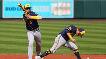 ST LOUIS, MO - SEPTEMBER 27: Orlando Arcia #3 of the Milwaukee Brewers throws over Luis Urias #2 of the Milwaukee Brewers to first base for an out against the St. Louis Cardinals in the first inning at Busch Stadium on September 27, 2020 in St Louis, Missouri. (Photo by Dilip Vishwanat/Getty Images)