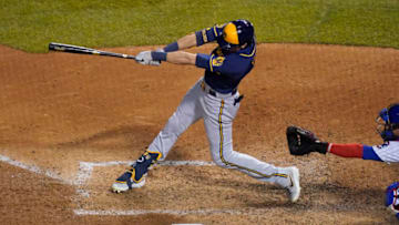 CHICAGO, ILLINOIS - AUGUST 14: Christian Yelich #22 of the Milwaukee Brewers hits a three run home run during the sixth inning of a game against the Chicago Cubs at Wrigley Field on August 14, 2020 in Chicago, Illinois. (Photo by Nuccio DiNuzzo/Getty Images)