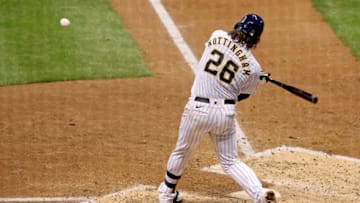 MILWAUKEE, WISCONSIN - SEPTEMBER 16: Jacob Nottingham #26 of the Milwaukee Brewers hits a home run in the sixth inning against the St. Louis Cardinals during game two of a doubleheader at Miller Park on September 16, 2020 in Milwaukee, Wisconsin. (Photo by Dylan Buell/Getty Images)