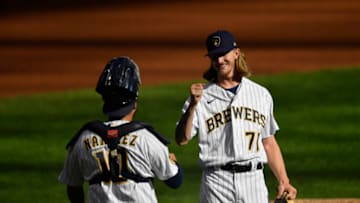 MILWAUKEE, WISCONSIN - SEPTEMBER 20: Josh Hader #71 and Omar Narvaez #10 of the Milwaukee Brewers celebrate the team win against the Kansas City Royals at Miller Park on September 20, 2020 in Milwaukee, Wisconsin. (Photo by Quinn Harris/Getty Images)