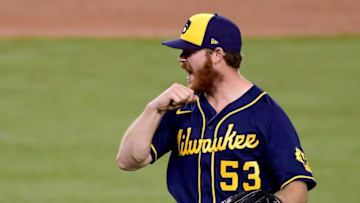 LOS ANGELES, CALIFORNIA - OCTOBER 01: Brandon Woodruff #53 of the Milwaukee Brewers reacts towards the home plate umpire as he leaves the game after a double from Mookie Betts #50 of the Los Angeles Dodgers, to take a 3-0 lead, during the fifth inning in game two of the National League Wild Card Series at Dodger Stadium on October 01, 2020 in Los Angeles, California. (Photo by Harry How/Getty Images)