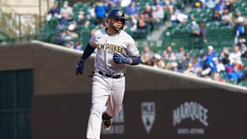 CHICAGO, ILLINOIS - APRIL 24: Manny Pina #9 of the Milwaukee Brewers hits a two run home run during a game against the Chicago Cubs at Wrigley Field on April 24, 2021 in Chicago, Illinois. (Photo by Nuccio DiNuzzo/Getty Images)