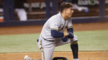 MIAMI, FLORIDA - MAY 08: Luis Urias #2 of the Milwaukee Brewers reacts after striking out during the seventh inning against the Miami Marlins at loanDepot park on May 08, 2021 in Miami, Florida. (Photo by Michael Reaves/Getty Images)