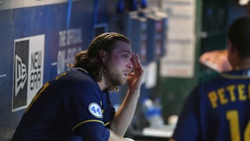 CLEVELAND, OHIO - SEPTEMBER 11: Starting pitcher Corbin Burnes #39 of the Milwaukee Brewers watches from the dugout during the sixth inning against the Cleveland Indians at Progressive Field on September 11, 2021 in Cleveland, Ohio. (Photo by Jason Miller/Getty Images)