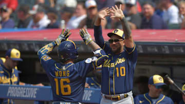 CLEVELAND, OHIO - SEPTEMBER 12: Kolten Wong #16 celebrates with Omar Narvaez #10 of the Milwaukee Brewers after Wong hit a solo homer during the first inning against the Cleveland Indians at Progressive Field on September 12, 2021 in Cleveland, Ohio. (Photo by Jason Miller/Getty Images)
