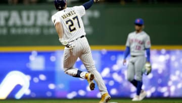 MILWAUKEE, WISCONSIN - SEPTEMBER 24: Willy Adames #27 of the Milwaukee Brewers hits a solo home run in the third inning against the New York Mets at American Family Field on September 24, 2021 in Milwaukee, Wisconsin. (Photo by John Fisher/Getty Images)