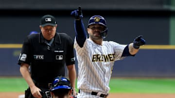 MILWAUKEE, WISCONSIN - SEPTEMBER 18: Manny Pina #9 of the Milwaukee Brewers points to the fans after scoring a run in the game against the Chicago Cubs at American Family Field on September 18, 2021 in Milwaukee, Wisconsin. (Photo by Justin Casterline/Getty Images)