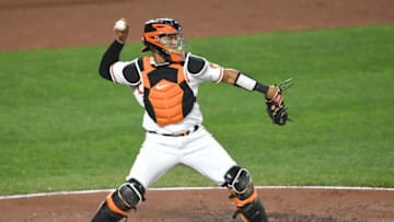 BALTIMORE, MD - SEPTEMBER 28: Pedro Severino #28 of the Baltimore Orioles throws to second base during a baseball game against the Boston Red Sox at Oriole Park at Camden Yards on September 28, 2021 in Baltimore, Maryland. (Photo by Mitchell Layton/Getty Images)