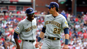 ATLANTA, GEORGIA - OCTOBER 11: Christian Yelich #22 of the Milwaukee Brewers interacts with Lorenzo Cain #6 prior to game 3 of the National League Division Series at Truist Park on October 11, 2021 in Atlanta, Georgia. (Photo by Kevin C. Cox/Getty Images)