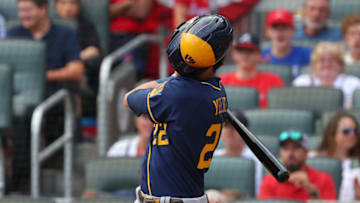 ATLANTA, GEORGIA - OCTOBER 12: Christian Yelich #22 of the Milwaukee Brewers bats during the first inning against the Atlanta Braves in game four of the National League Division Series at Truist Park on October 12, 2021 in Atlanta, Georgia. (Photo by Kevin C. Cox/Getty Images)
