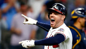 ATLANTA, GEORGIA - OCTOBER 12: Freddie Freeman #5 of the Atlanta Braves reacts after hitting a home run during the eighth inning against the Milwaukee Brewers in game four of the National League Division Series at Truist Park on October 12, 2021 in Atlanta, Georgia. (Photo by Michael Zarrilli/Getty Images)