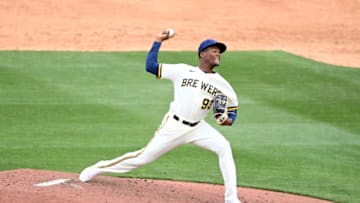 PHOENIX, ARIZONA - MARCH 26: Abner Uribe #93 of the Milwaukee Brewers delivers a pitch against the Seattle Mariners during a spring training game at American Family Fields of Phoenix on March 26, 2022 in Phoenix, Arizona. (Photo by Norm Hall/Getty Images)